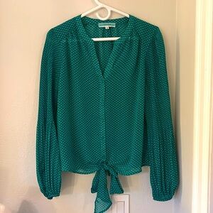 Sheer green button down blouse with tie in front and bell sleeve at the bottom